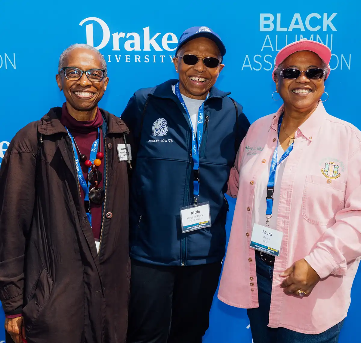 Drake University Black Alumni Association members Kittie Weston-Knauer, Myra Butts, and a colleague posing together at a formal campus reunion event.