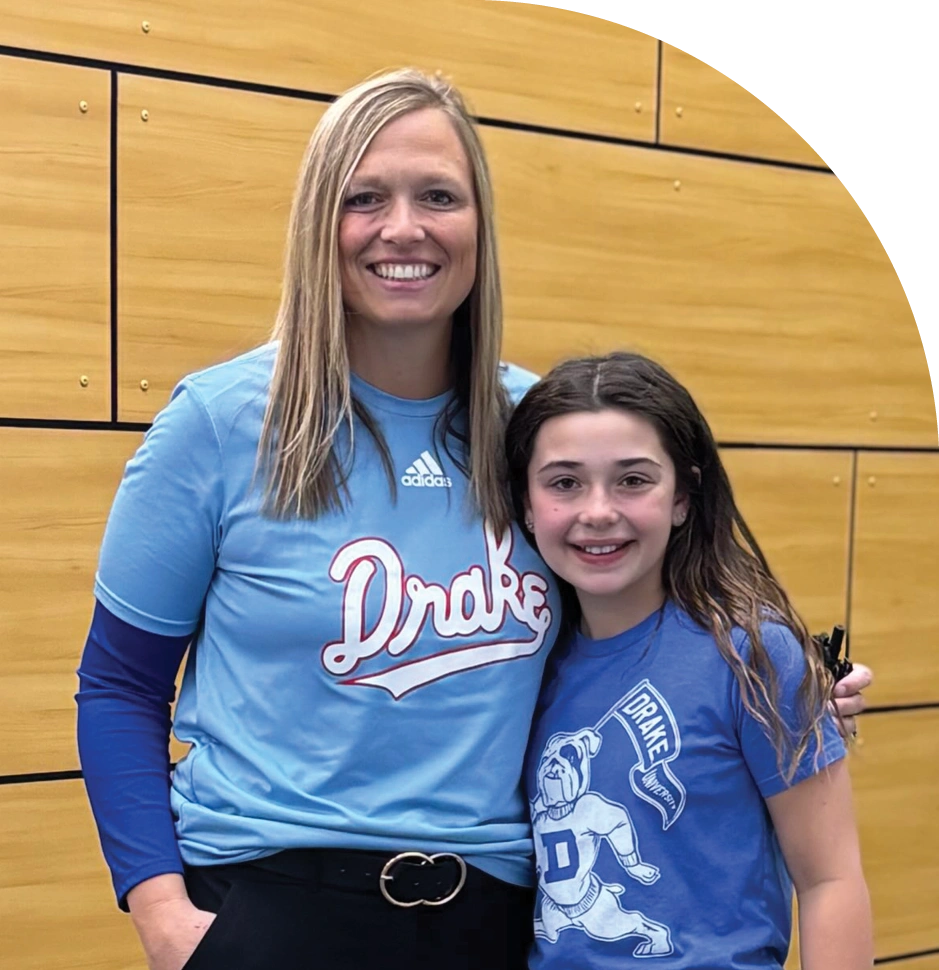 Dr. Kimberly J. Tierney and a student wearing Drake gear