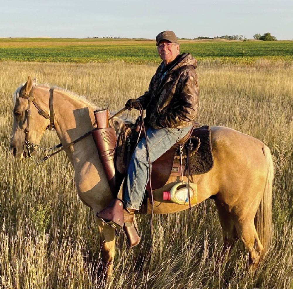 Douglas P. Meyer sitting on a horse