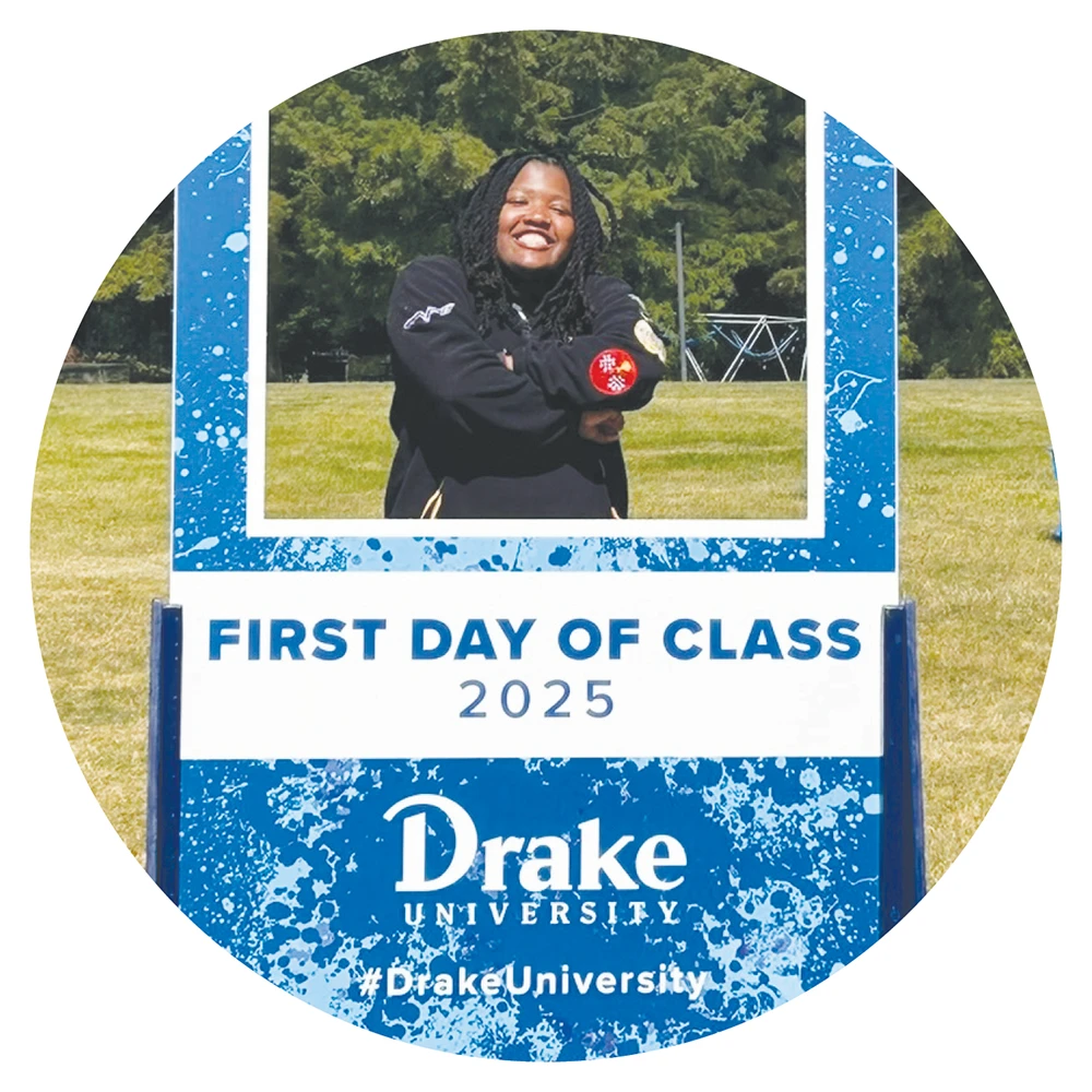 Ty Walls poses inside a "FIRST DAY OF CLASS 2025" Drake University photo frame cut-out.