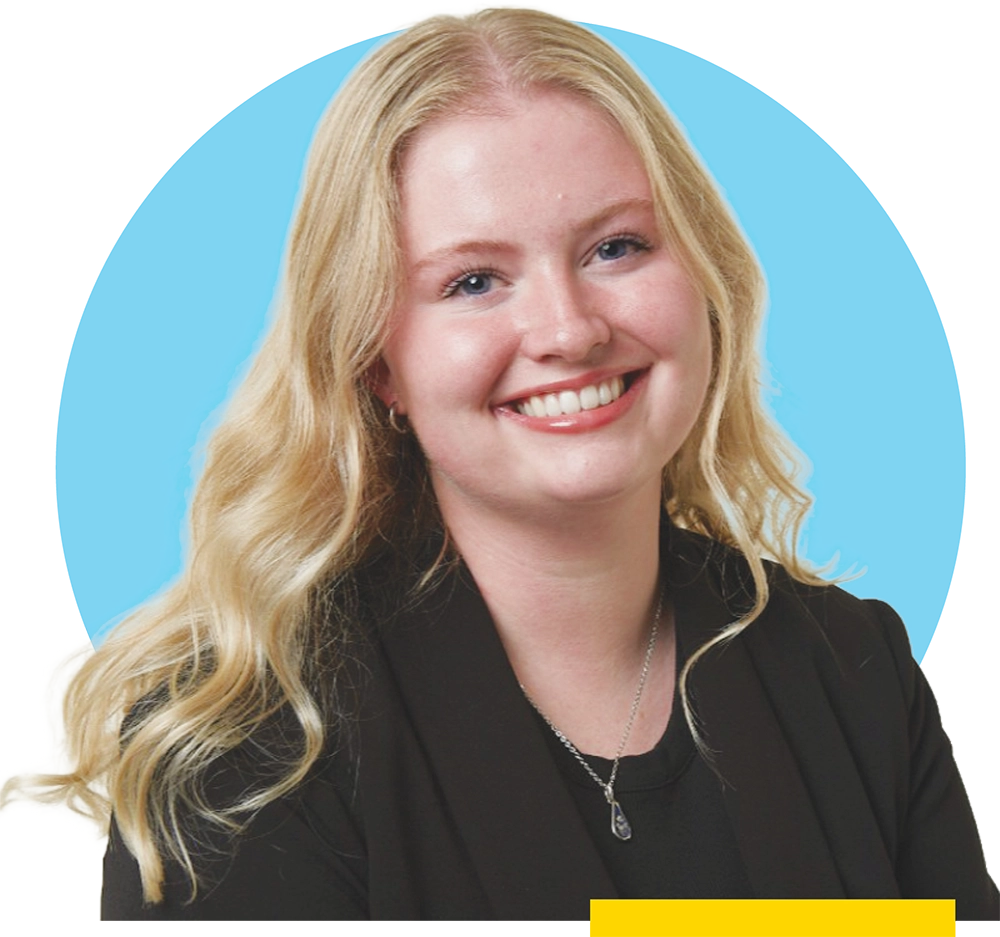 Emerson Whittemore wearing a black top against a light blue circle background.