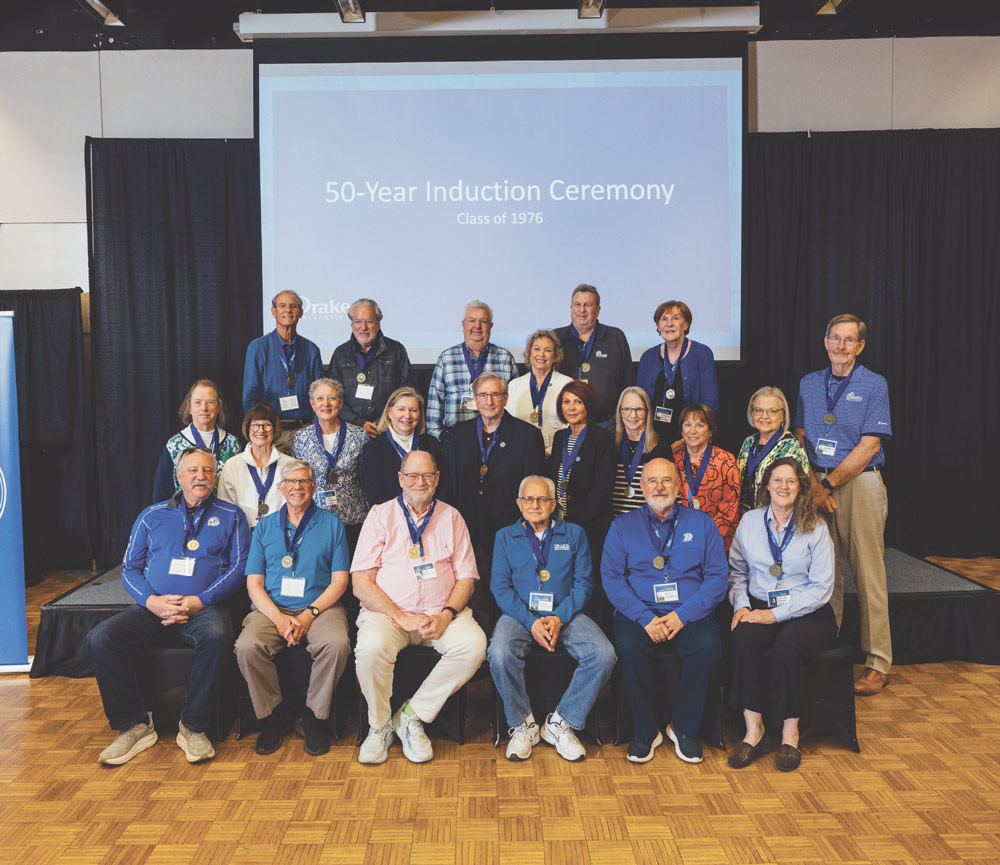 Group portrait of alumni seated and standing during the Class of 1976 50-Year Induction Ceremony.